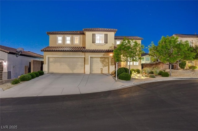 9413 Artesian Oak Ct, Las Vegas, NV 89149 - mediterranean / spanish-style house featuring stucco siding, an attached garage, concrete driveway, and a tile roof