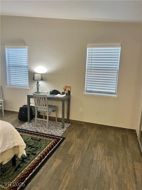 office area featuring baseboards and wood finished floors
