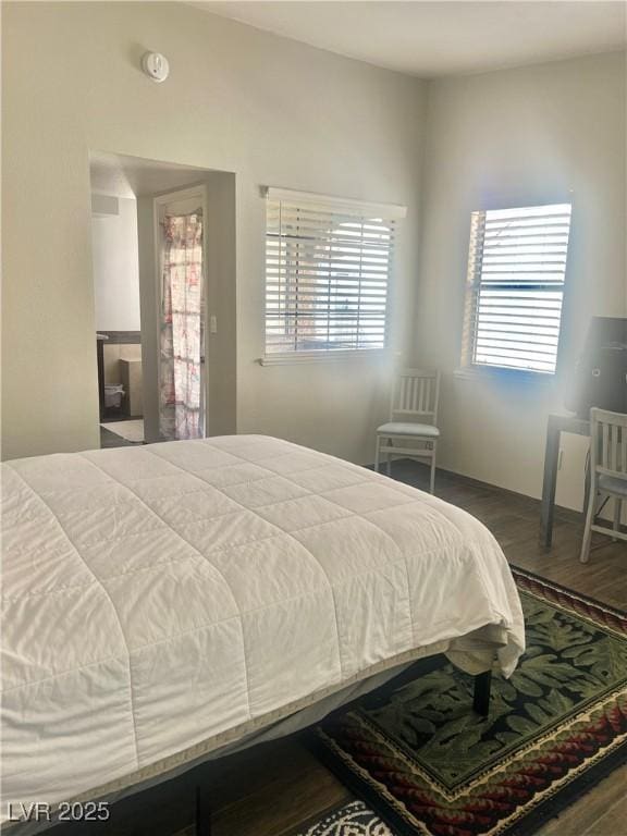 bedroom featuring wood finished floors