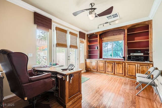 215 Sunset Shower Dr, Henderson, NV 89012 - office featuring visible vents, a healthy amount of sunlight, ornamental molding, light wood finished floors, and a ceiling fan