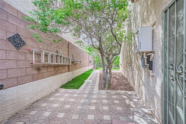 215 Sunset Shower Dr, Henderson, NV 89012 - surrounding community with a patio