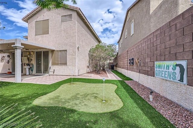 215 Sunset Shower Dr, Henderson, NV 89012 - back of house featuring a patio, central AC, stucco siding, and fence