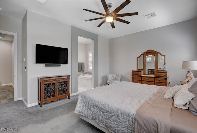bedroom featuring visible vents, baseboards, ensuite bathroom, a ceiling fan, and carpet flooring