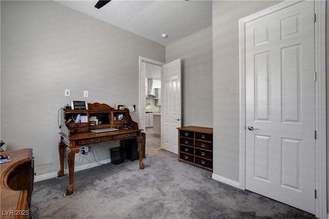 carpeted office with baseboards