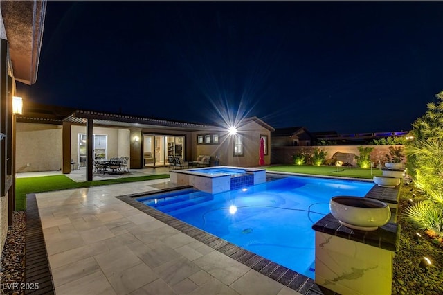 pool at night with a pergola, a patio, and a pool with connected hot tub