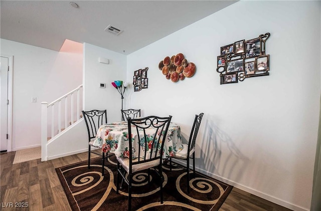 1035 Spotted Saddle St, Henderson, NV 89015 - dining space with stairs, wood finished floors, and visible vents