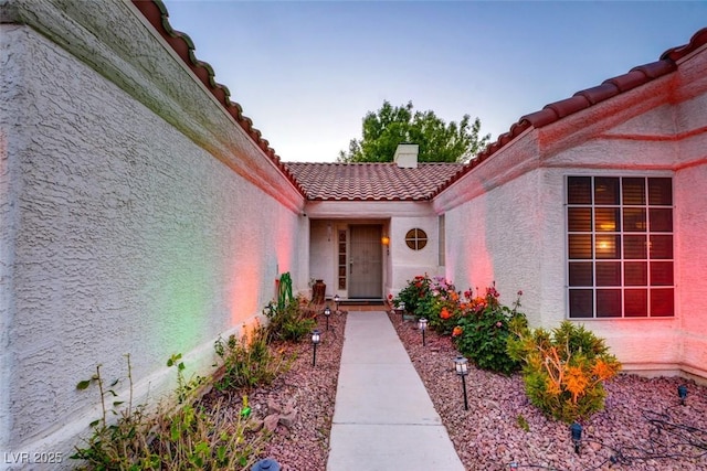 4517 Inez Dr, Las Vegas, NV 89130 - doorway to property featuring a tiled roof and stucco siding