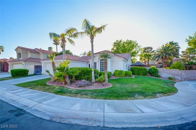 4517 Inez Dr, Las Vegas, NV 89130 - view of front of home featuring a garage, a tile roof, stucco siding, and concrete driveway