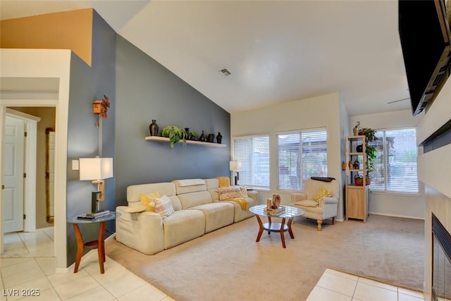 4517 Inez Dr, Las Vegas, NV 89130 - living area with light colored carpet, light tile patterned flooring, baseboards, a fireplace, and lofted ceiling