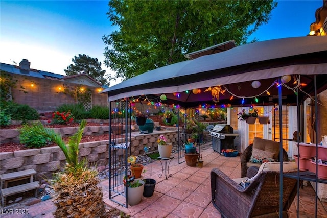 4517 Inez Dr, Las Vegas, NV 89130 - view of patio with a gazebo, grilling area, exterior kitchen, and an outdoor hangout area
