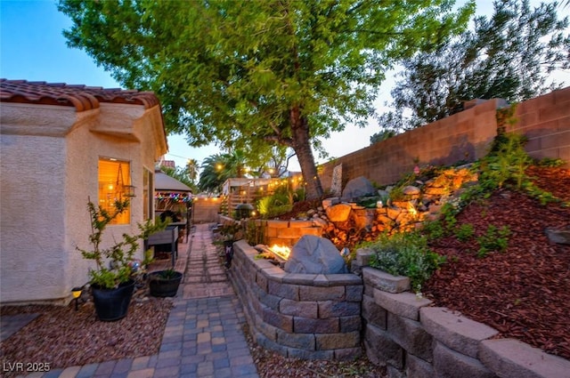 4517 Inez Dr, Las Vegas, NV 89130 - fenced backyard featuring a fire pit and a patio area