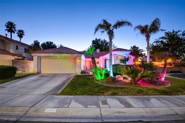 4517 Inez Dr, Las Vegas, NV 89130 - mediterranean / spanish-style house with a tile roof, a garage, driveway, stucco siding, and a front lawn