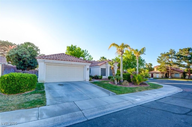 4517 Inez Dr, Las Vegas, NV 89130 - view of front facade featuring an attached garage, a tile roof, driveway, and stucco siding