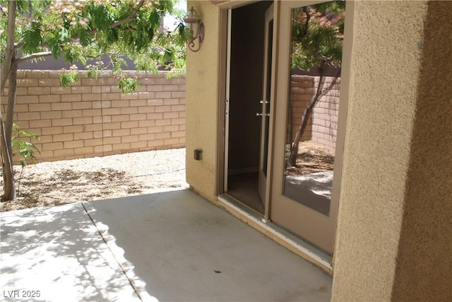 932 Tafalla Ct, Las Vegas, NV 89138 - entrance to property with fence, a patio, and stucco siding
