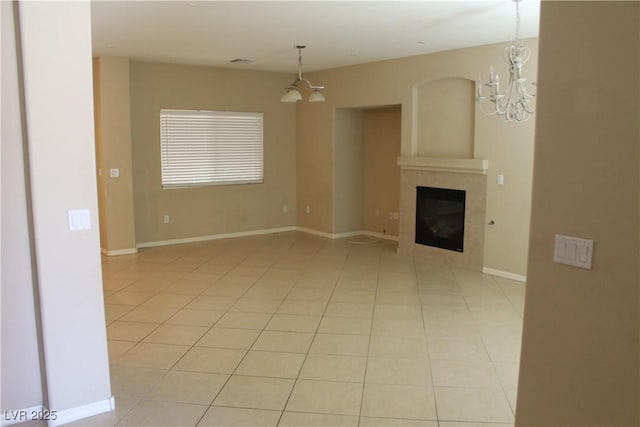 932 Tafalla Ct, Las Vegas, NV 89138 - unfurnished living room with a chandelier, a fireplace, light tile patterned floors, and baseboards