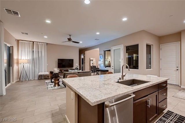 kitchen featuring stainless steel dishwasher, a ceiling fan, a sink, light tile patterned flooring, and visible vents