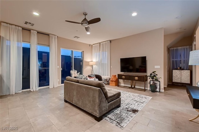 living room featuring ceiling fan, visible vents, and recessed lighting