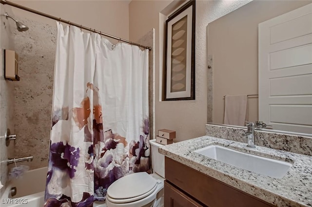bathroom featuring shower / tub combo, vanity, and toilet