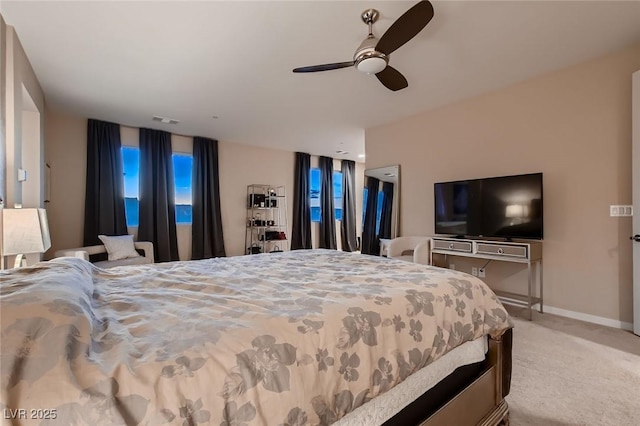 bedroom featuring visible vents, carpet flooring, baseboards, and ceiling fan