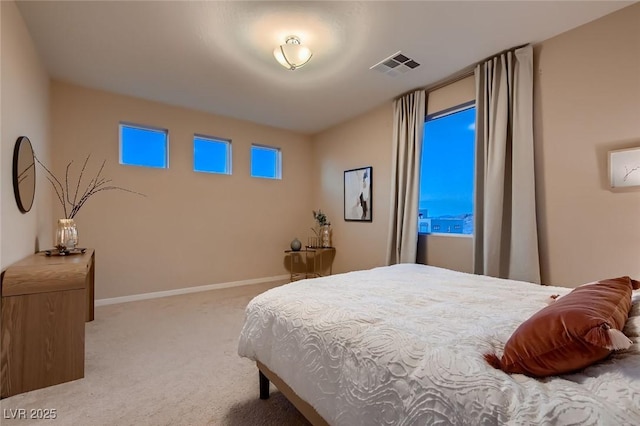 bedroom with baseboards, carpet flooring, and visible vents