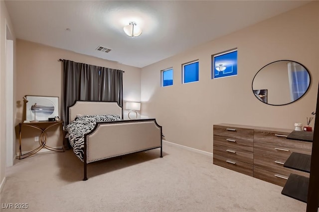 carpeted bedroom with visible vents and baseboards
