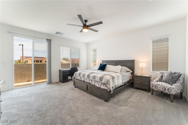 bedroom with access to outside, a ceiling fan, visible vents, and carpet