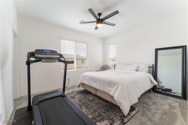 carpeted bedroom featuring visible vents, a ceiling fan, and baseboards