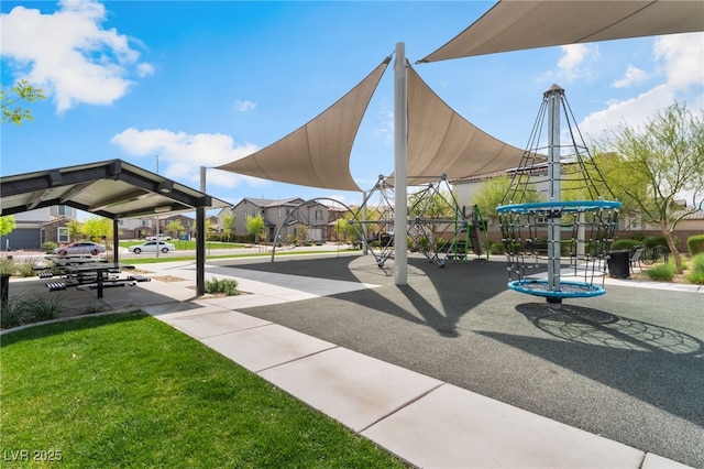 view of home's community featuring a yard and playground community