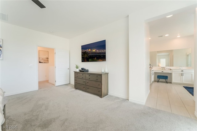 living area featuring baseboards, ceiling fan, light colored carpet, recessed lighting, and light tile patterned floors
