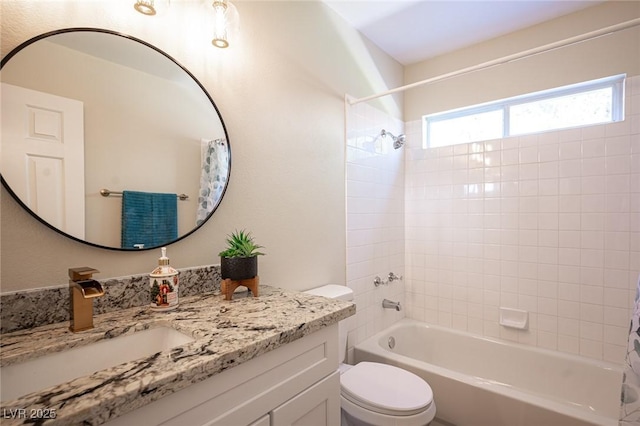bathroom featuring shower / bath combo, toilet, and vanity