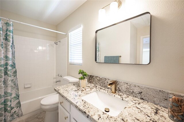 full bathroom featuring toilet, vanity, and shower / bath combination with curtain