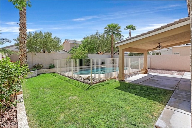 681 Peach Coral St, Las Vegas, NV 89183 - view of pool featuring a ceiling fan, a patio area, a fenced in pool, a fenced backyard, and a yard