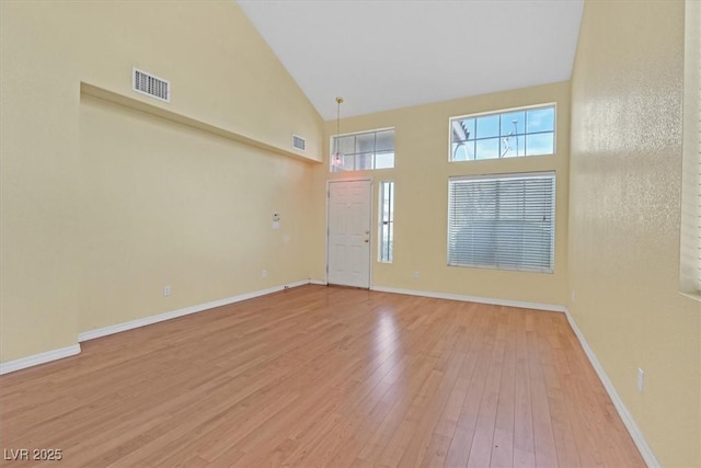 681 Peach Coral St, Las Vegas, NV 89183 - interior space with high vaulted ceiling, visible vents, baseboards, and light wood finished floors