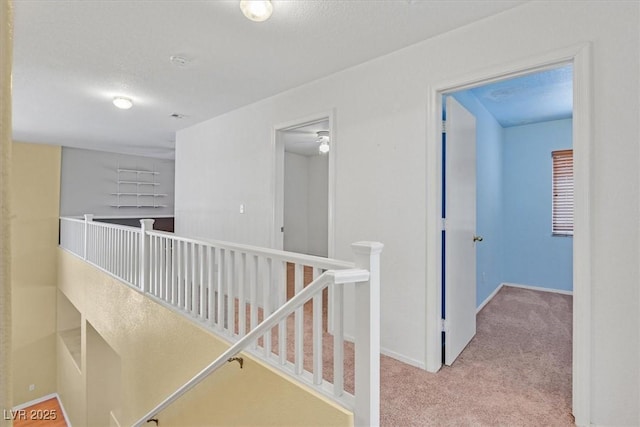 681 Peach Coral St, Las Vegas, NV 89183 - hall with carpet floors, baseboards, and an upstairs landing
