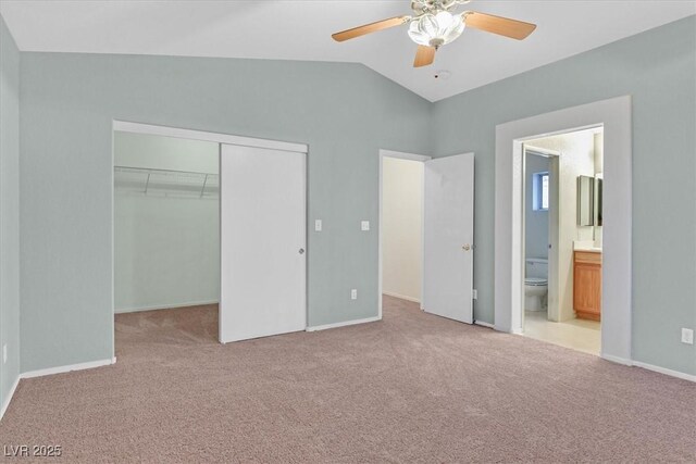 681 Peach Coral St, Las Vegas, NV 89183 - unfurnished bedroom with a closet, carpet flooring, ensuite bathroom, and vaulted ceiling