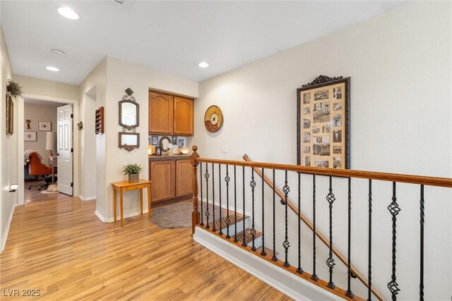 648 Sunrise Lake Pl, Henderson, NV 89002 - hall featuring recessed lighting, baseboards, an upstairs landing, and light wood-type flooring