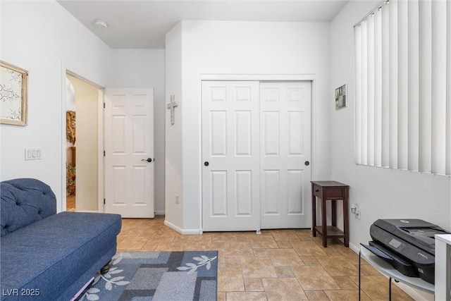 648 Sunrise Lake Pl, Henderson, NV 89002 - sitting room with baseboards and stone finish flooring