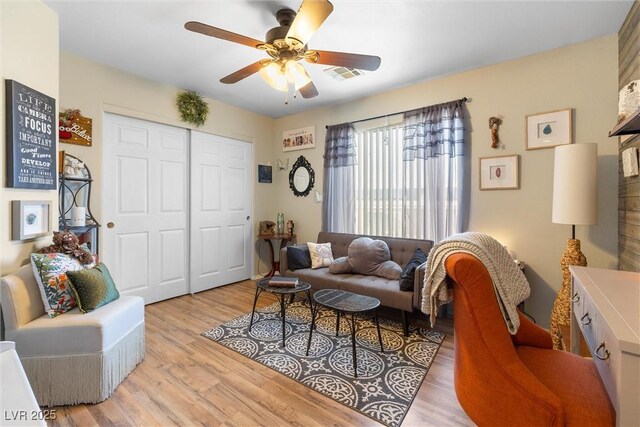 648 Sunrise Lake Pl, Henderson, NV 89002 - living area with ceiling fan, visible vents, and light wood-type flooring