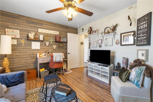 648 Sunrise Lake Pl, Henderson, NV 89002 - living room featuring wooden walls, a ceiling fan, and wood finished floors