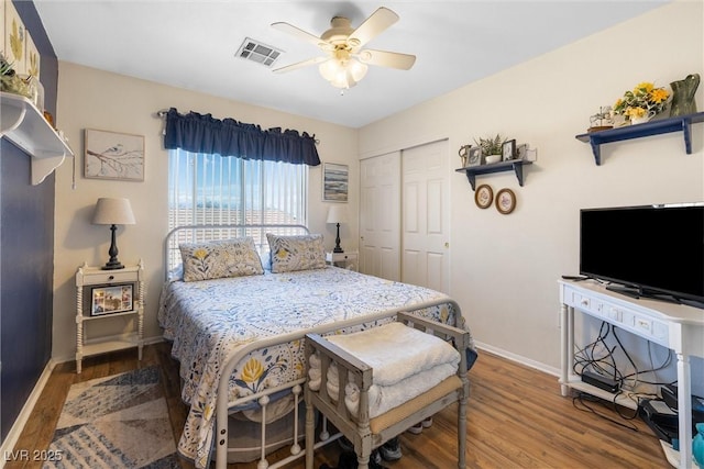 648 Sunrise Lake Pl, Henderson, NV 89002 - bedroom featuring baseboards, a closet, wood finished floors, and visible vents