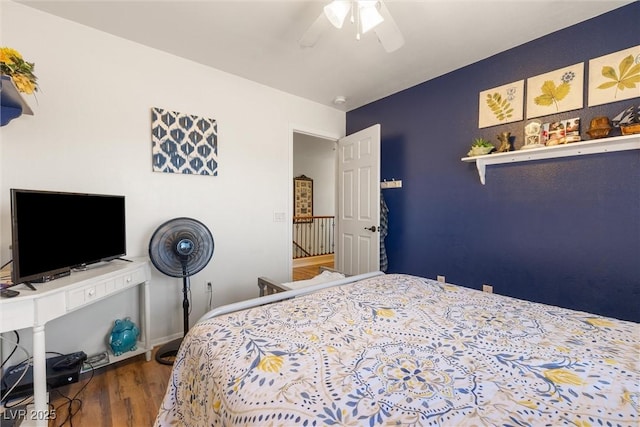 648 Sunrise Lake Pl, Henderson, NV 89002 - bedroom with a ceiling fan and wood finished floors