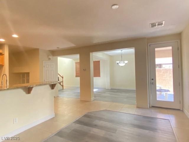 8374 Pioneer Way, Las Vegas, NV 89113 - interior space featuring stairs, light tile patterned floors, visible vents, and baseboards