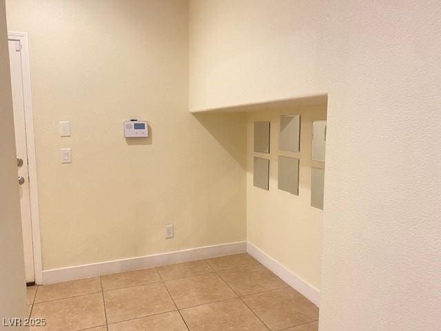 8374 Pioneer Way, Las Vegas, NV 89113 - washroom featuring baseboards and light tile patterned flooring