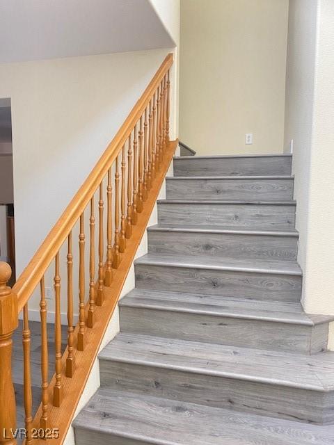 8374 Pioneer Way, Las Vegas, NV 89113 - staircase with wood finished floors