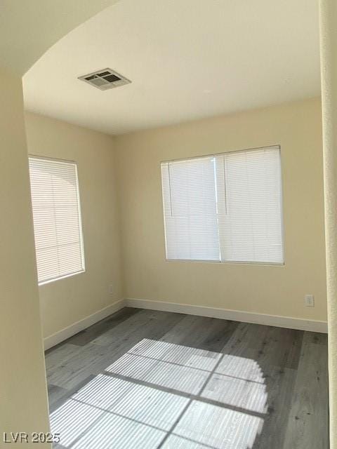 8374 Pioneer Way, Las Vegas, NV 89113 - empty room with wood finished floors, baseboards, and visible vents