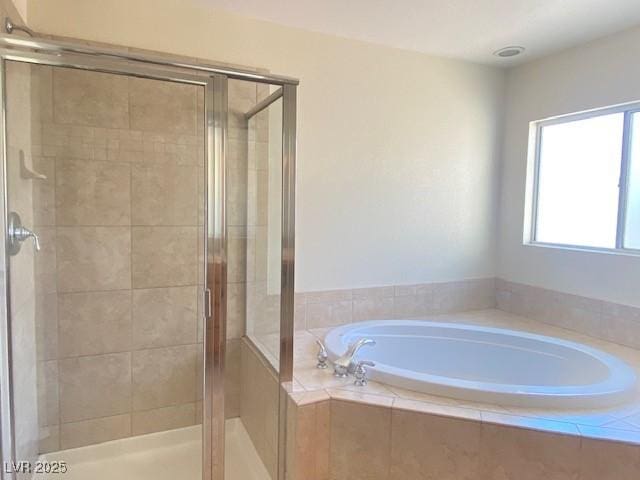 8374 Pioneer Way, Las Vegas, NV 89113 - bathroom featuring a shower stall and a bath