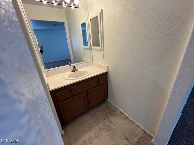 bathroom featuring vanity and tile patterned flooring