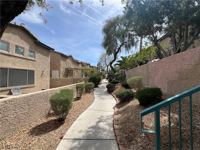 view of property's community featuring fence