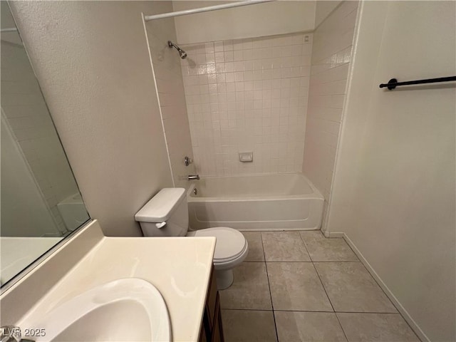bathroom with vanity, toilet, washtub / shower combination, tile patterned floors, and baseboards