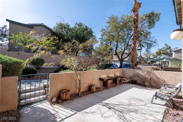 view of patio with a gate and fence private yard